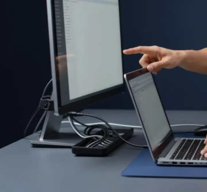 Modern office with staff using newly configured laptops